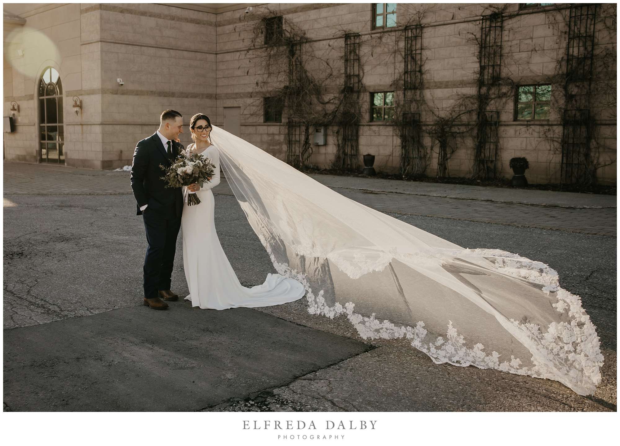 Bride and groom in front of the Royal Ambassador Banquet